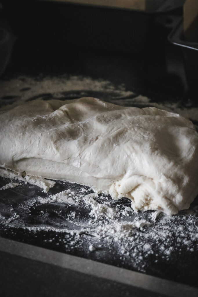 half of a batch of homemade sandwich bread dough ready for shaping.