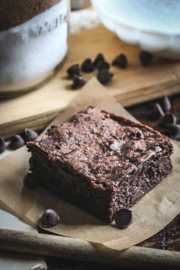 close up view of a thick, fudgy homemade brownie made from diy boxed brownie mix.
