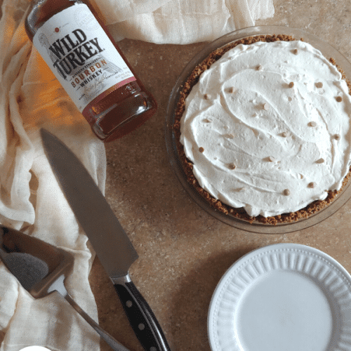 overhead view of homemade butterscotch pudding pie with bourbon.