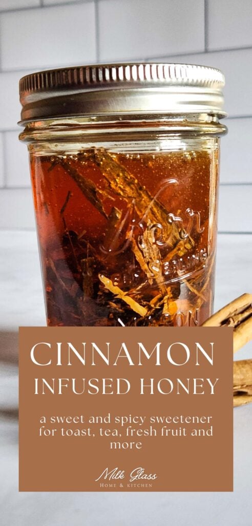 glass mason jar with homemade cinnamon infused honey in front of a tile surface.