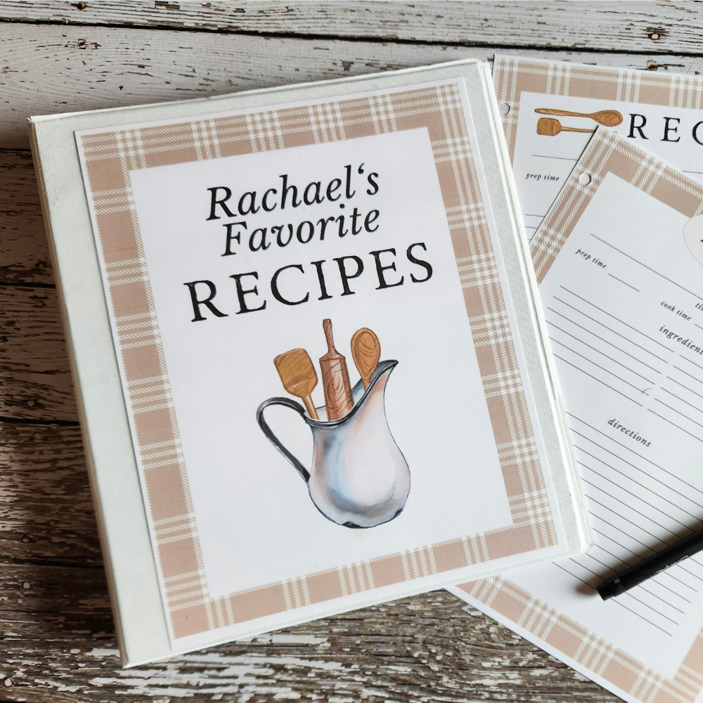 overhead view of a binder that reads "rachael's favorite recipes" to highlight a printable recipe binder.
