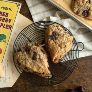 fresh cherry scones cooling on a vintage wire rack.
