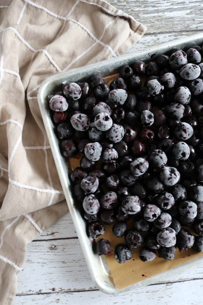 frozen cherries on a sheet pan.