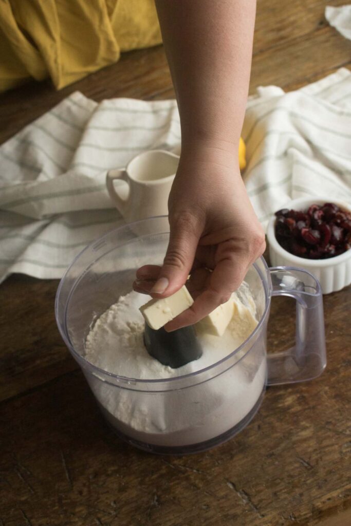 cutting butter into scone dough.