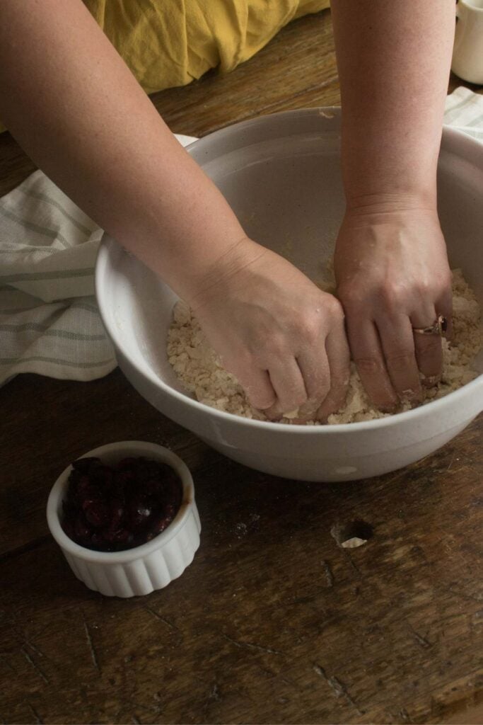 compressing scone dough.