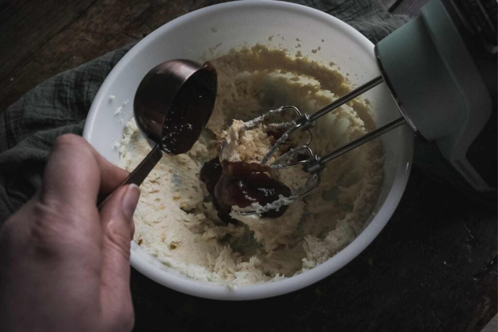 adding pear butter to cookie dough.