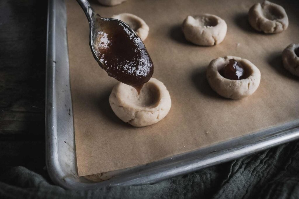 filling cookies with pear butter.