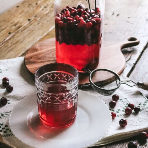 cocktail glass with homemade cranberry liqueur.