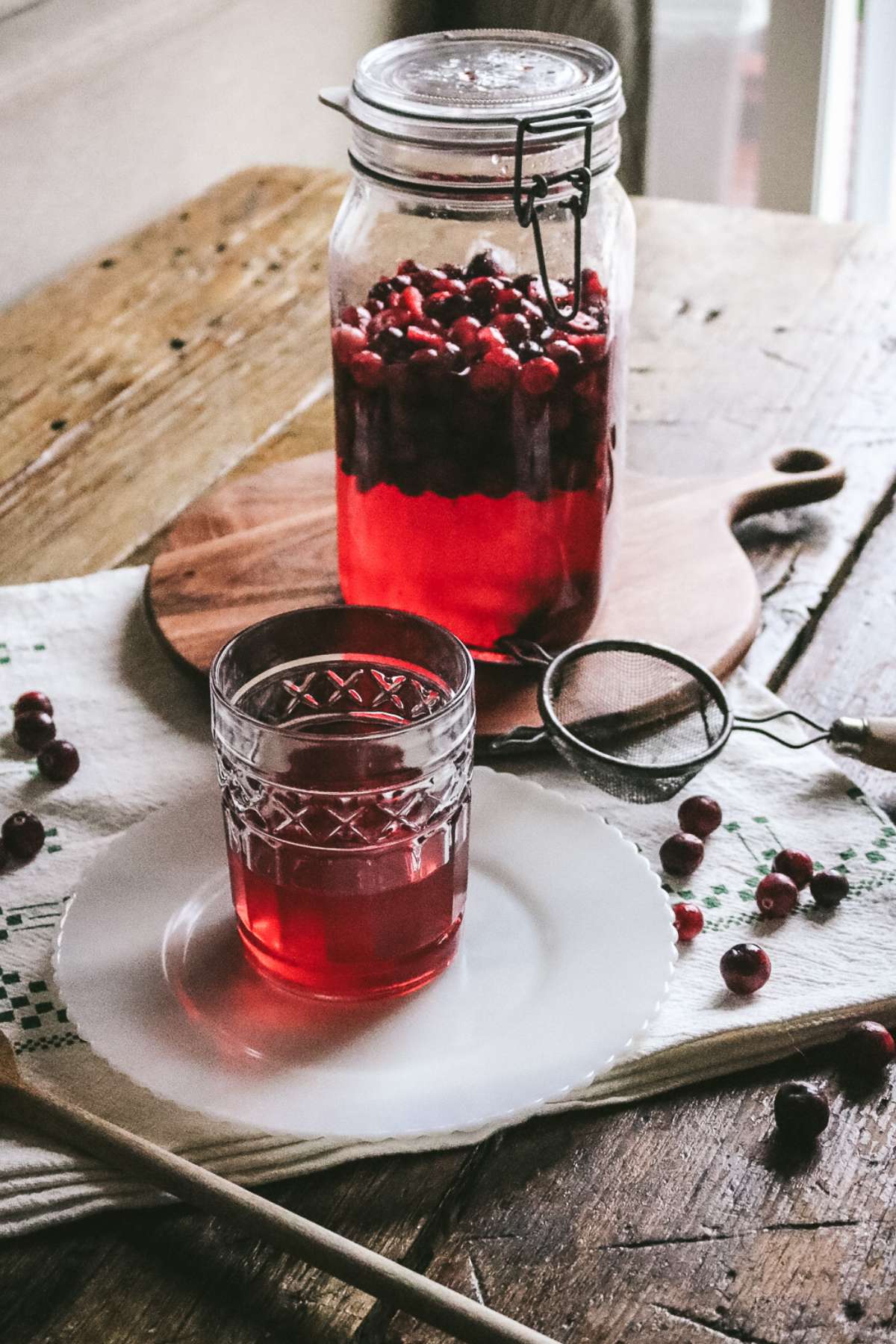 cocktail glass with homemade cranberry liqueur.