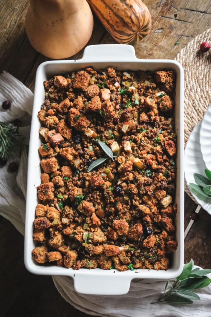 white baking dish with homemade sourdough cornbread stuffing.