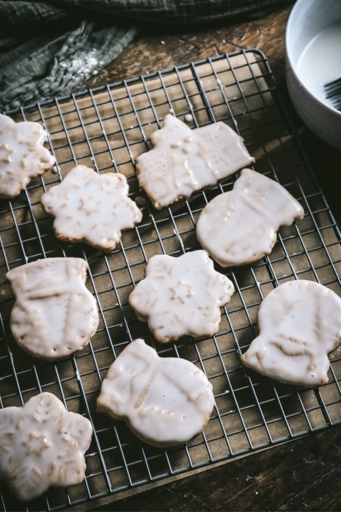 overhead view of glazed honey gingerbread cooling on a wire rack.
