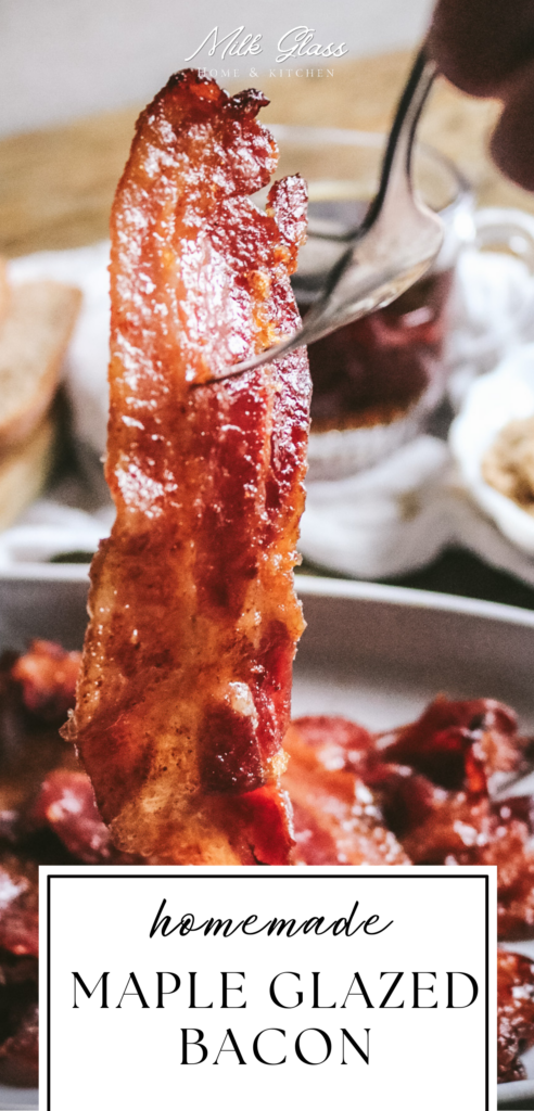 picking up a piece of maple bacon with a fork.