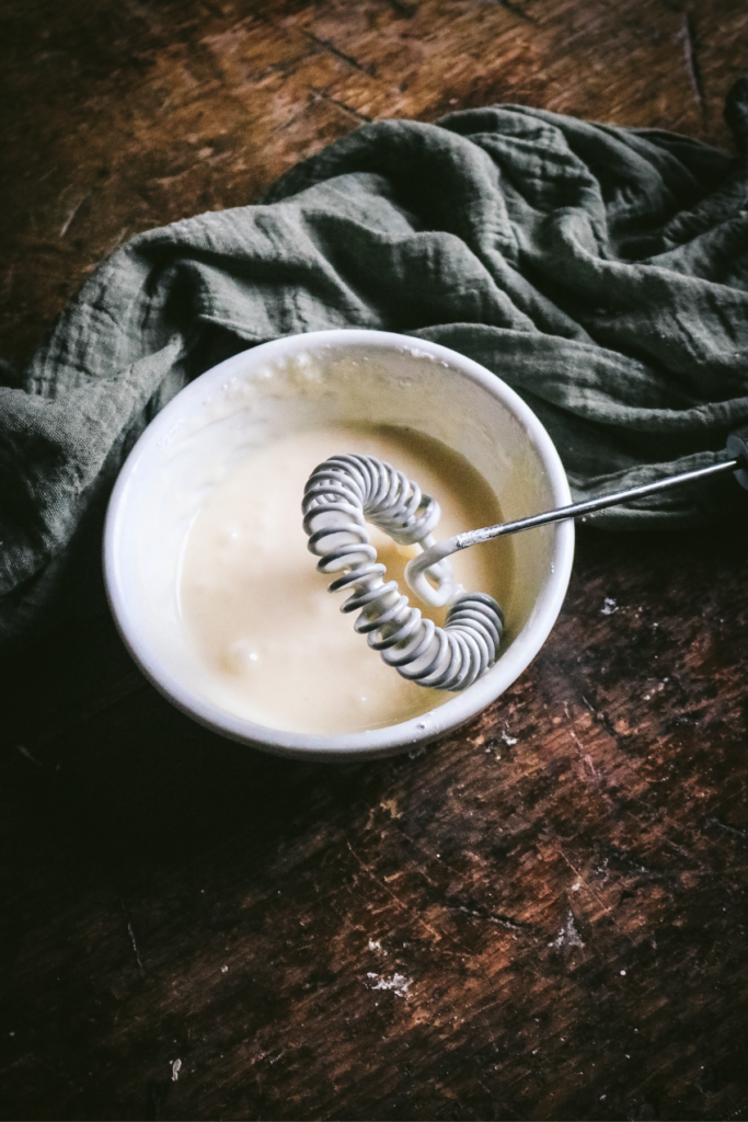 homemade eggnog glaze in a small bowl.