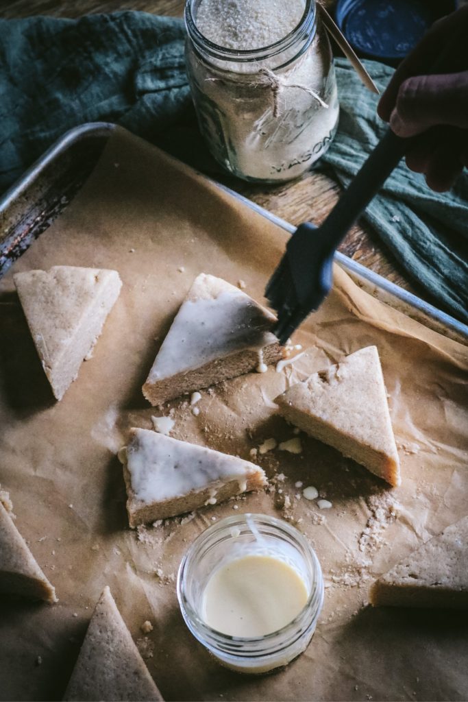 glazing scones with eggnog before baking.