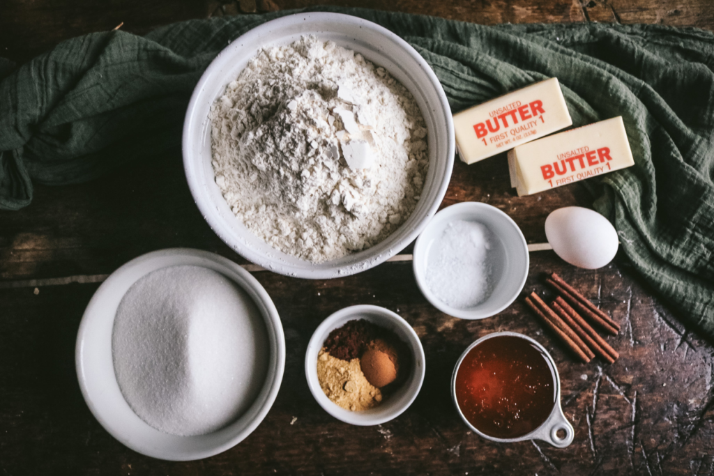 contains with flour, sugar, salt, baking soda, egg, butter, honey, ginger, cloves, and cinnamon for honey gingerbread.