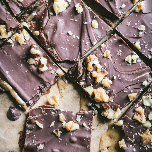 overhead view of homemade date bark on a piece of parchment paper.