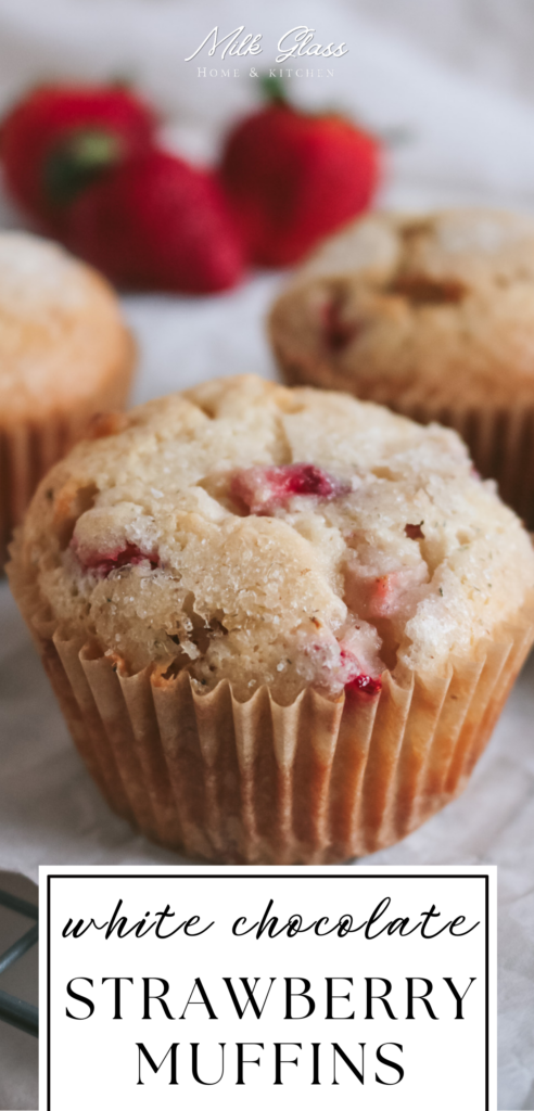 tall pin that reads white chocolate strawberry muffins with a close up image of the muffins with a crackly sugar crust from the lavender sugar sprinkled on top.