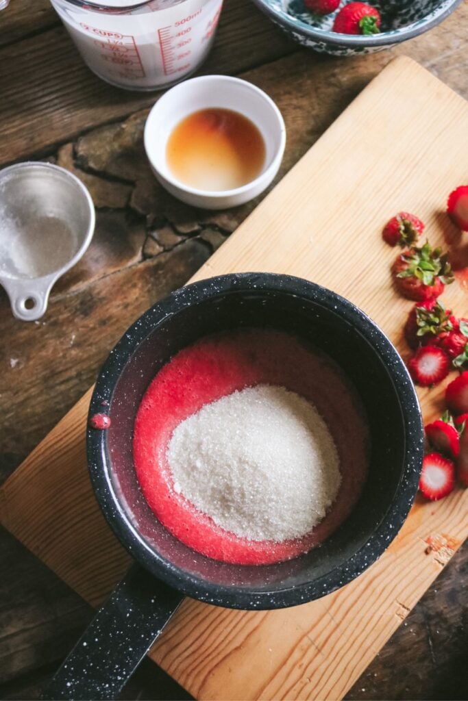 strawberry puree and sugar in a small pan.