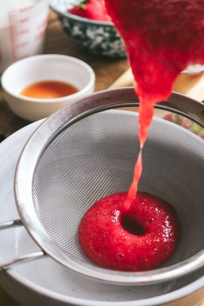 strawberry puree and sugar in a small pan.