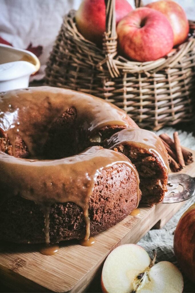 homemade applesauce bundt cake with butterscotch sauce on top.