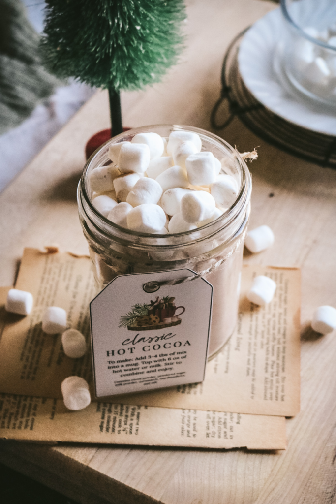mason jar with homemade hot cocoa mix including marshmallows on top.