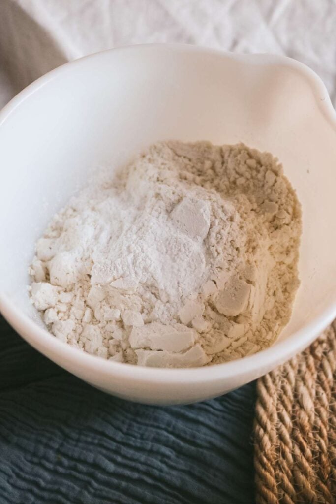 dry ingredients for muffin mix in a white bowl.