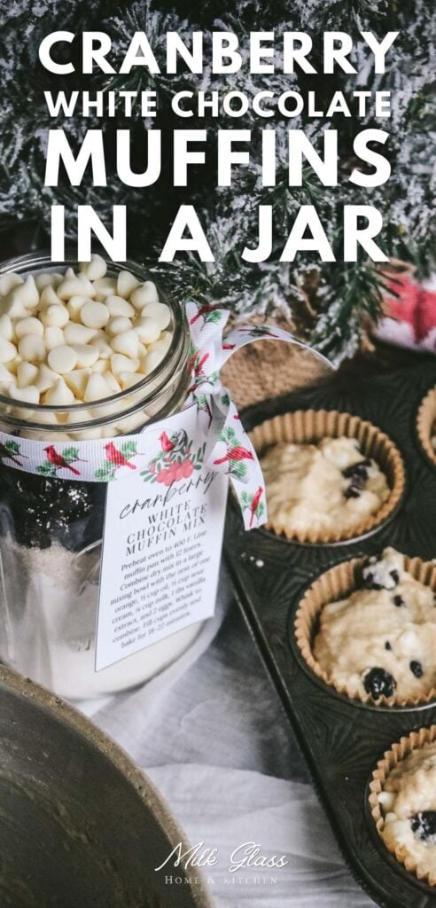 pinterest graphic for cranberry white chocolate muffins in a jar with a printable gift tag attached with ribbon next to a muffin pan ready to go in the oven.