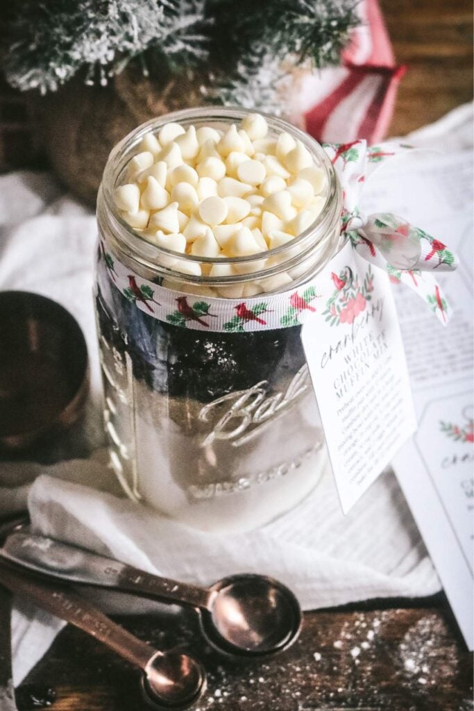 quart jar with homemade cranberry muffin mix for a homemade muffins in a jar christmas gift.