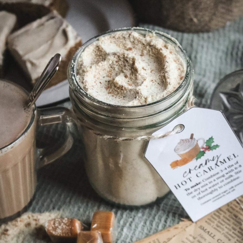 glass mason jar with a dry mixture of caramelized sugar, dry milk powder, cornstarch, and salt to make hot caramel milk, a hot cocoa alternative.