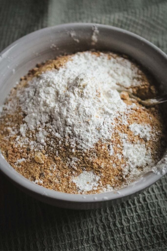 bowl with the ingredients to make caramel milk like caramel sugar and milk powder.
