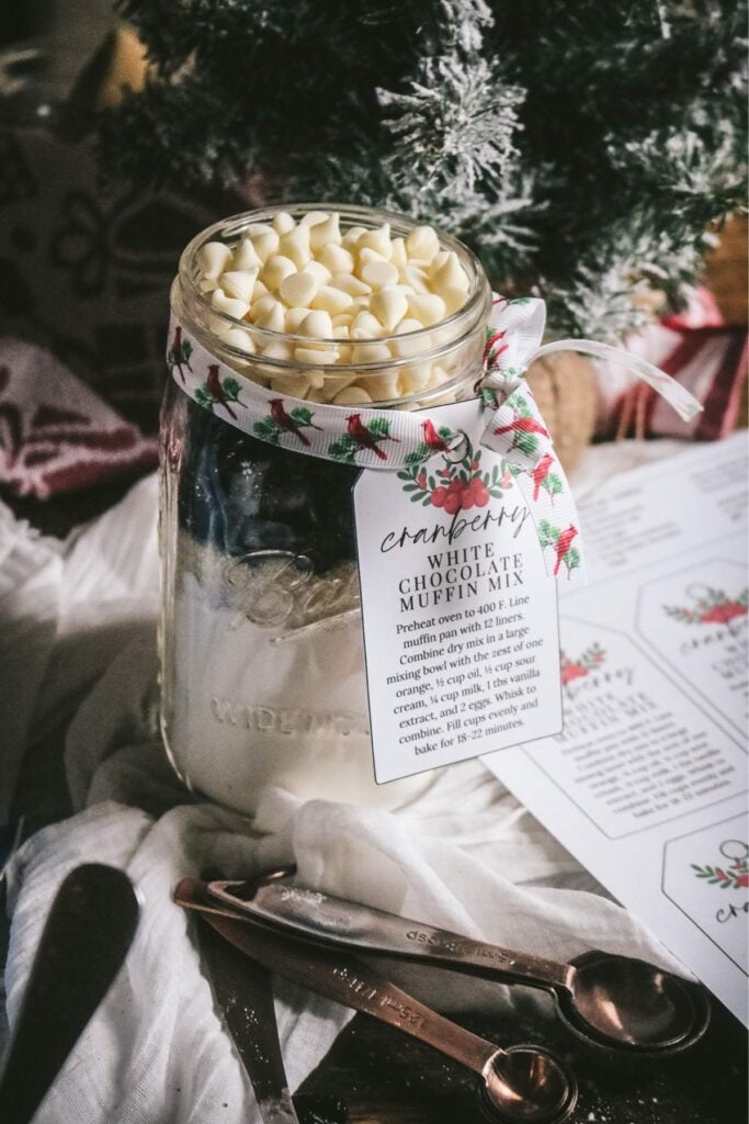 finished jar of homemade cranberry muffins in a jar with a printable label attached.