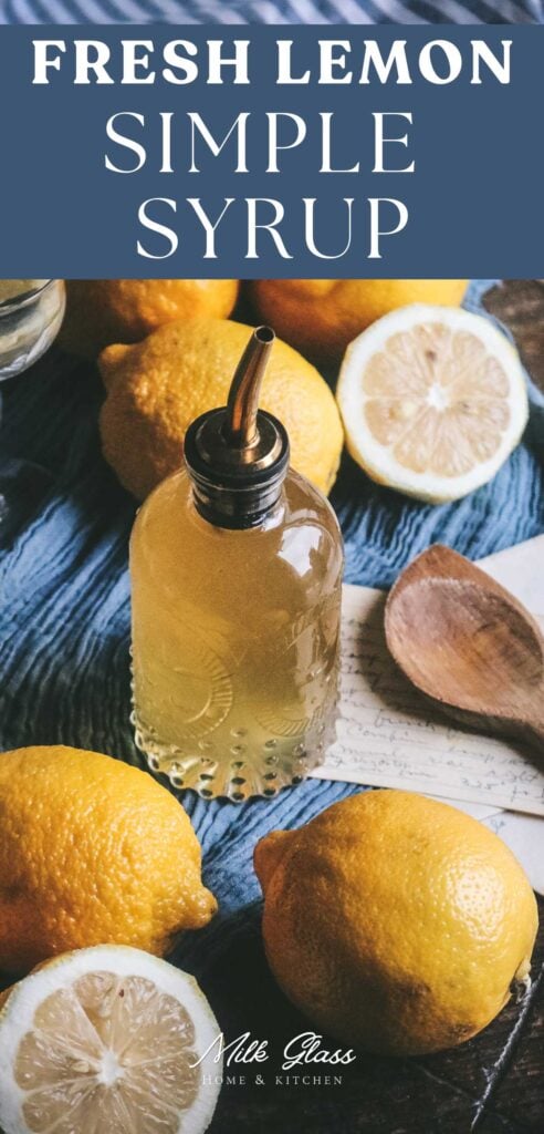 pin image of a glass bottle with homemade lemon syrup surrounded by fresh lemons on a blue cloth.
