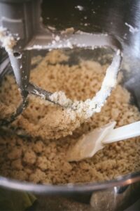 inside a mixing bowl with a crumbly shortbread mixture to show what it should look like before moving to the pan.