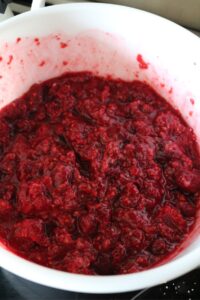 a mixing bowl with the jam, raspberries, and cornstarch for the filling.